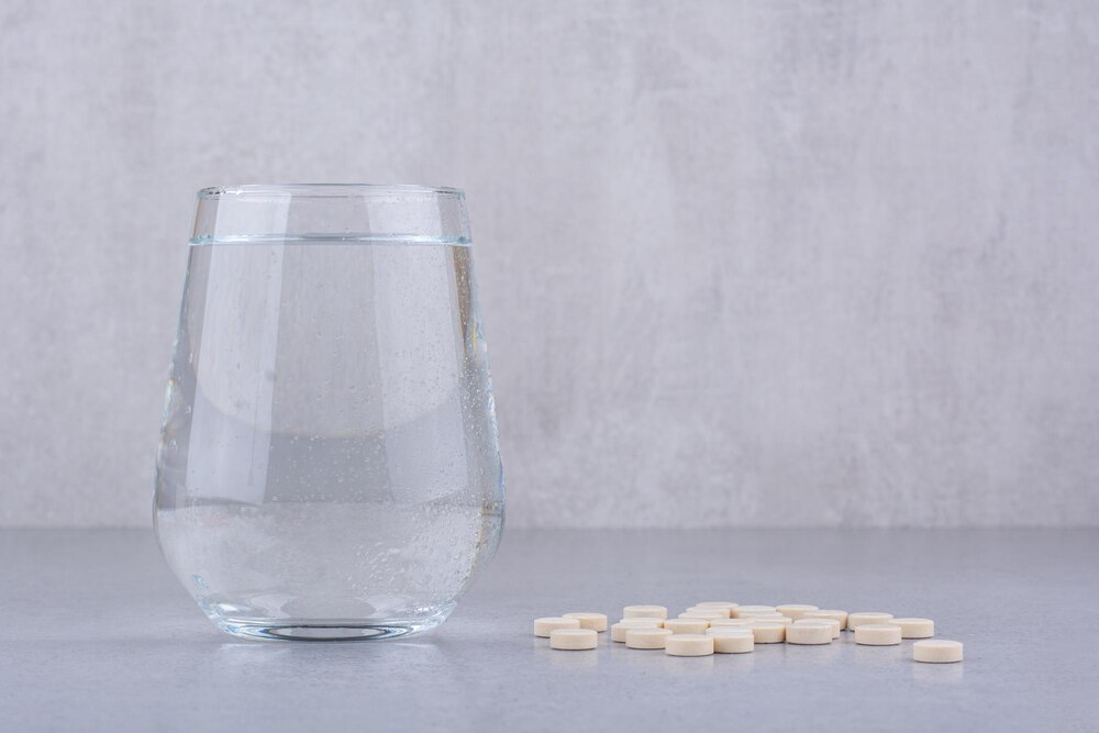 Pharmaceutical medicine pills and glass of water. High quality photo